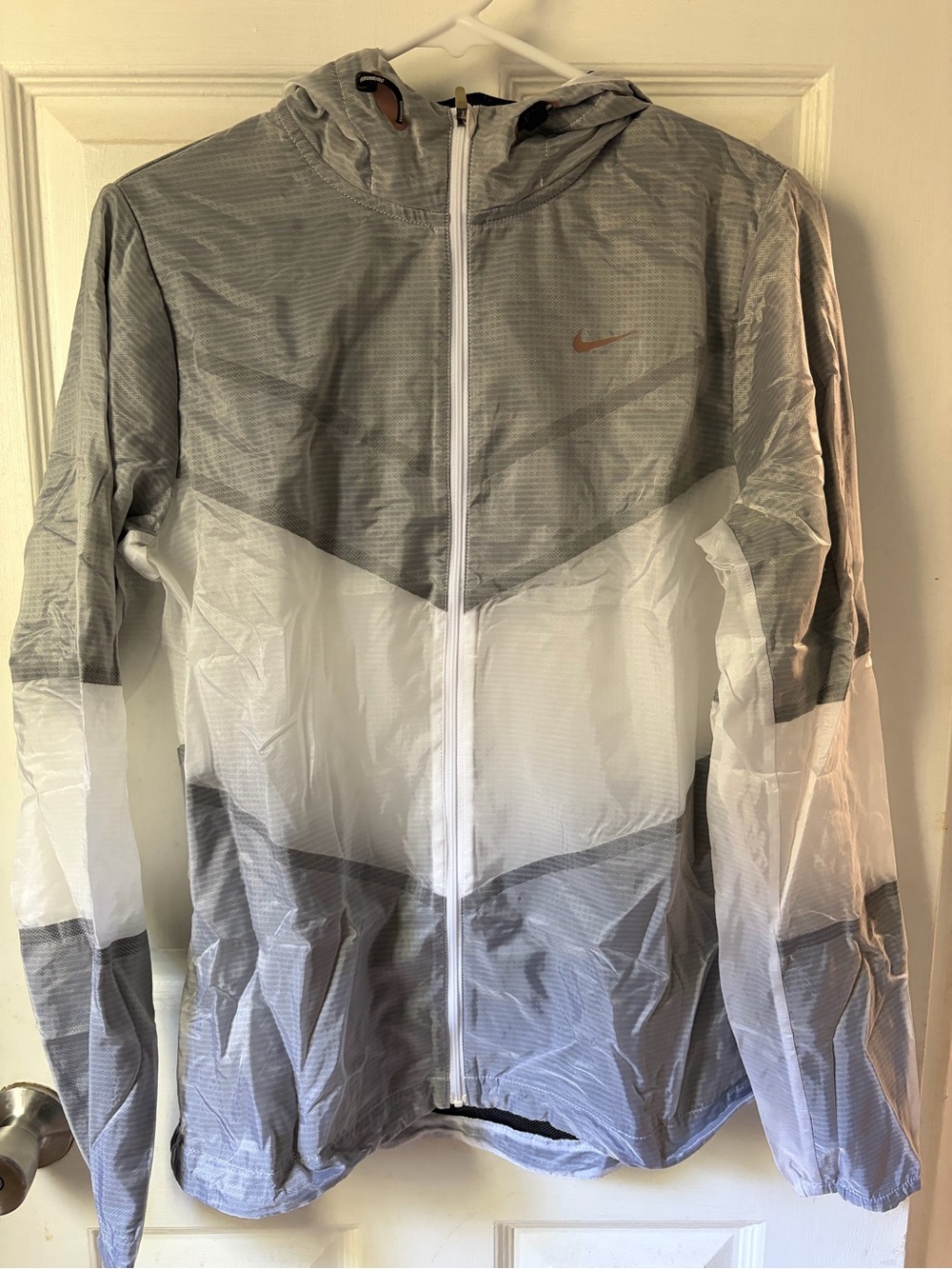 Nike women’s Gray and White Lightweight Windbreaker running Jacket